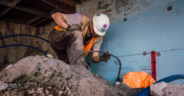 Construction worker digging in dirt