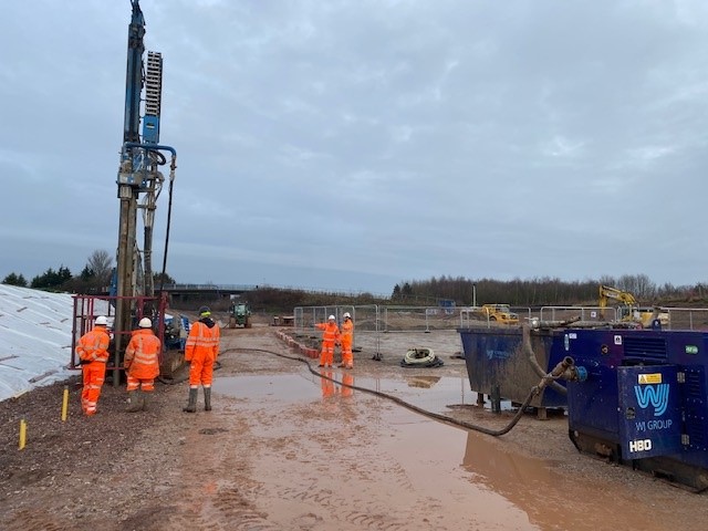 Construction workers in orange safety gear | Marston Box | Dewatering