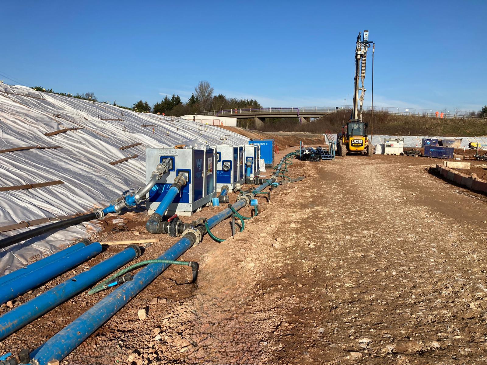 Construction workers in orange safety gear | Marston Box | Dewatering
