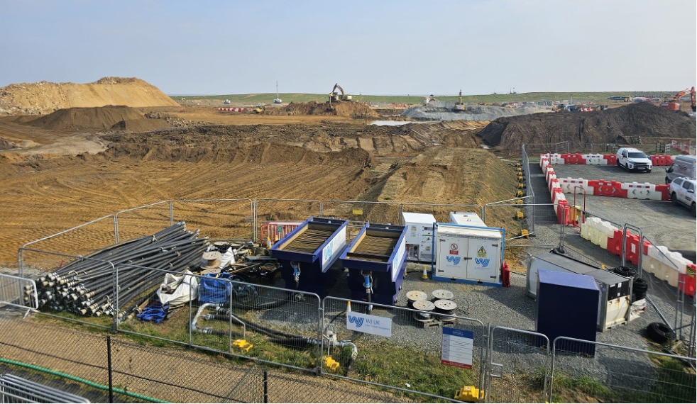 Construction site with heavy machinery visible.